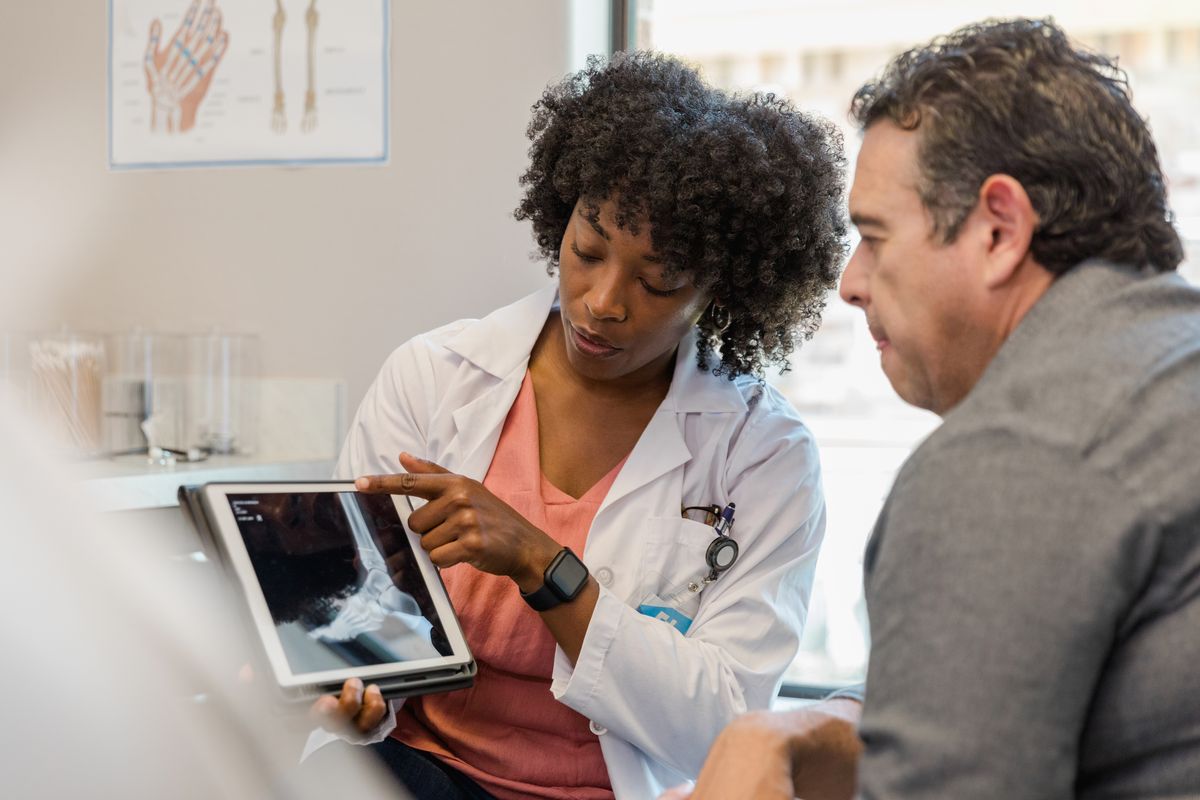 Surgeon reviewing personalized surgical plan with implant selection and approach strategy